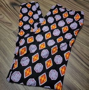 Lularoe super soft leggings, tall & curvy. Black w/blue, red, & orange.